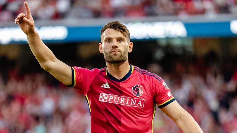 Eduard Löwen raising his index finger to signify 'number 1' after scoring a goal.